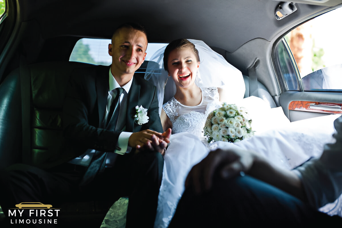 bride and groom in wedding attire sitting in a limousine, holding hands, with a bouquet of flowers